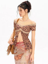 Woman wearing a leopard print top with sheer overlay